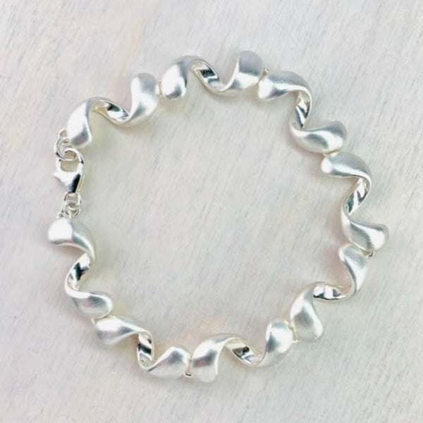 Matt and Polished Silver Curved 'Wiggly' Bracelet by JB Designs.