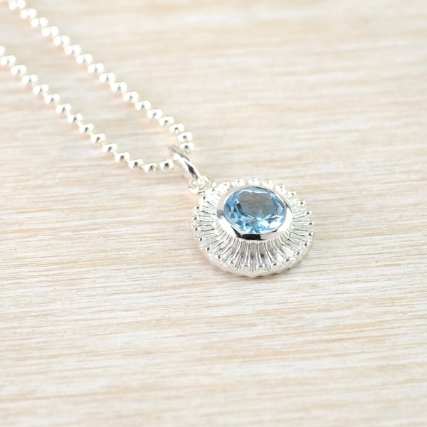 Round 'Sun' Silver and Blue Topaz Pendant.