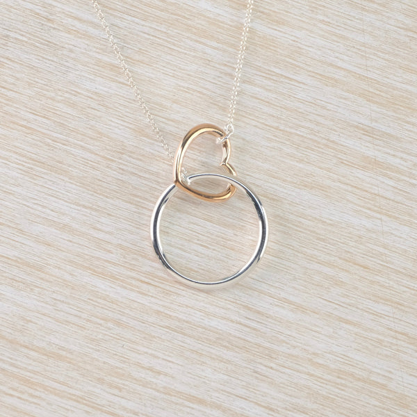 Silver Circle and Gold Plated Heart Necklace. Silver Circle and Gold Plated Heart Necklace.