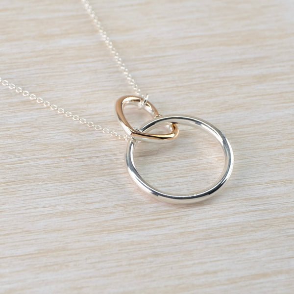 Silver Circle and Gold Plated Heart Necklace.