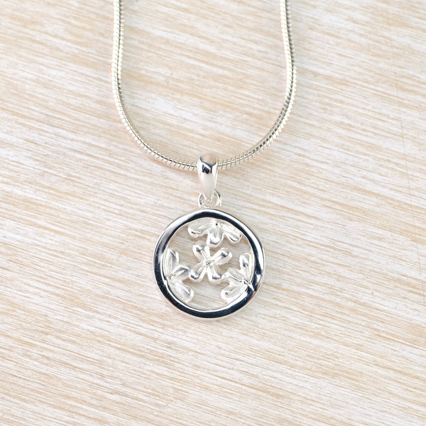 Sterling Silver Flowers in Circle Pendant by JB Designs. Sterling Silver Flowers in Circle Pendant by JB Designs.