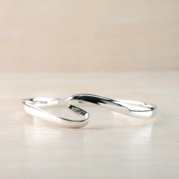 Sterling Silver Bangle with Twist Detail.