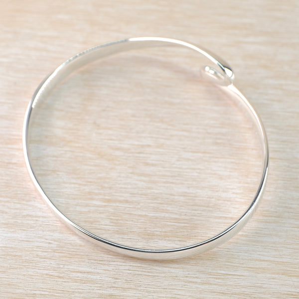 Sterling Silver Bangle with Twist Detail.