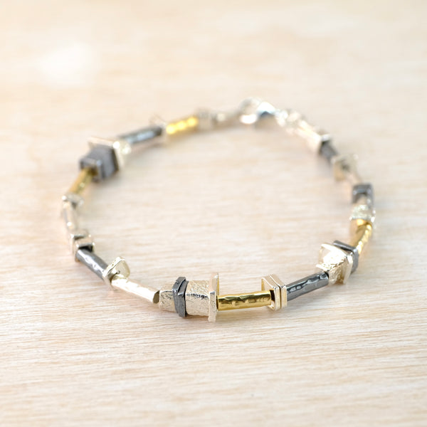 Silver and Rolled Gold Linked Bracelet by JB Designs.