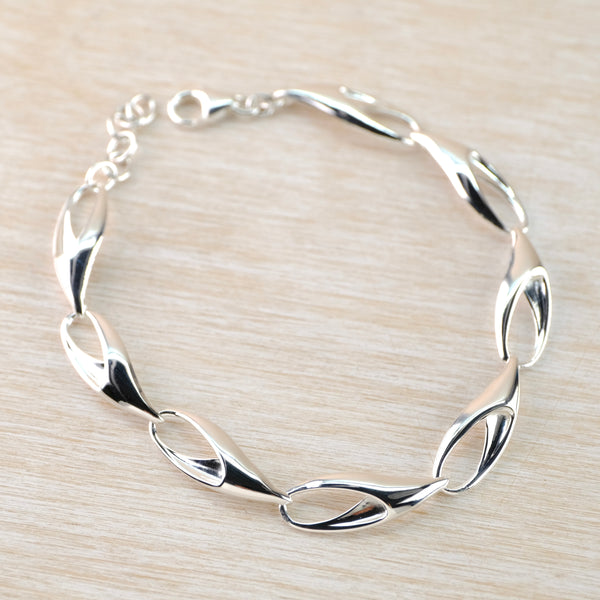Polished Silver Linked Bracelet by JB Designs.