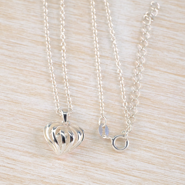 Small Sterling Silver Decorative Heart Shaped Pendant.