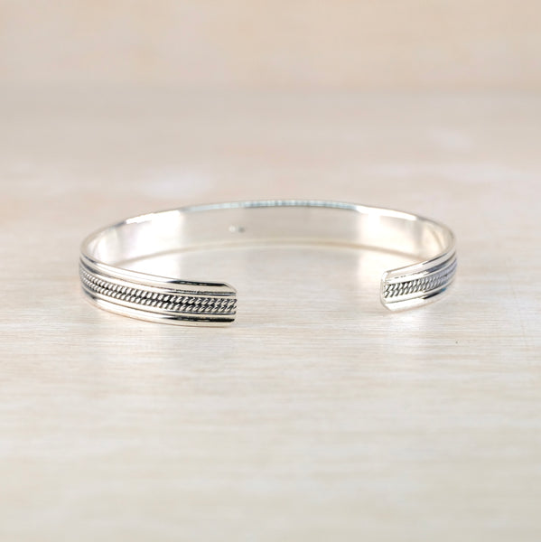Sterling Silver Slim Torque Bangle Bracelet with Decorative Detail.