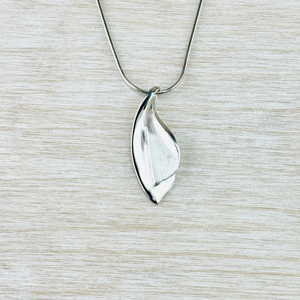 Satin and High Polished Silver Layered Leaf Pendant by JB Designs. Satin and High Polished Silver Layered Leaf Pendant by JB Designs.