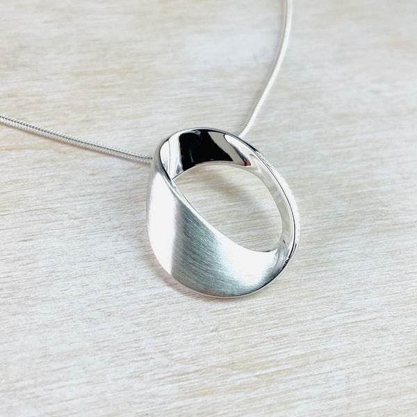 Brushed and Polished Silver Mobius Pendant by JB Designs.