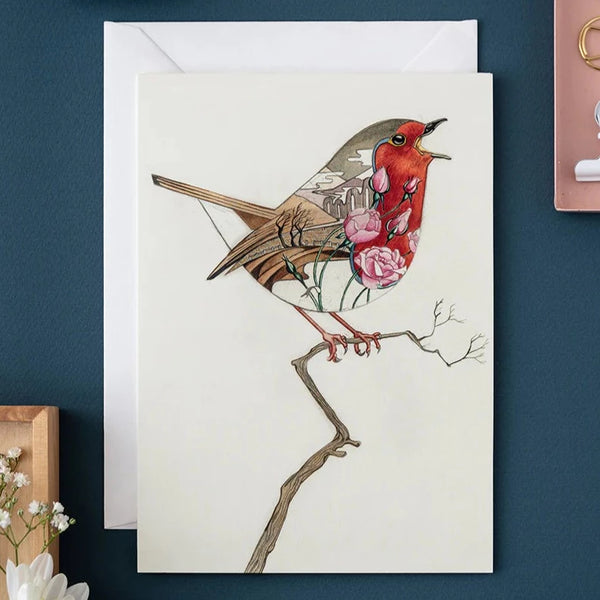A blank greetings card featuring a watercolor illustration of a robin bird perched on a branch, with a white envelope.