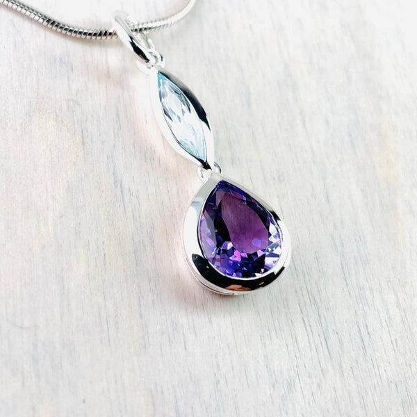 Sterling Silver, Blue Topaz and Amethyst Pendant.