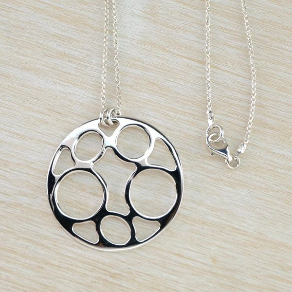 Contemporary Style Circular Sterling Silver Pendant.