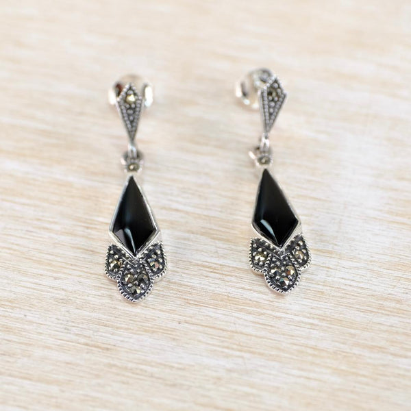 Pair of silver earrings with black gemstones in the Art Deco style.