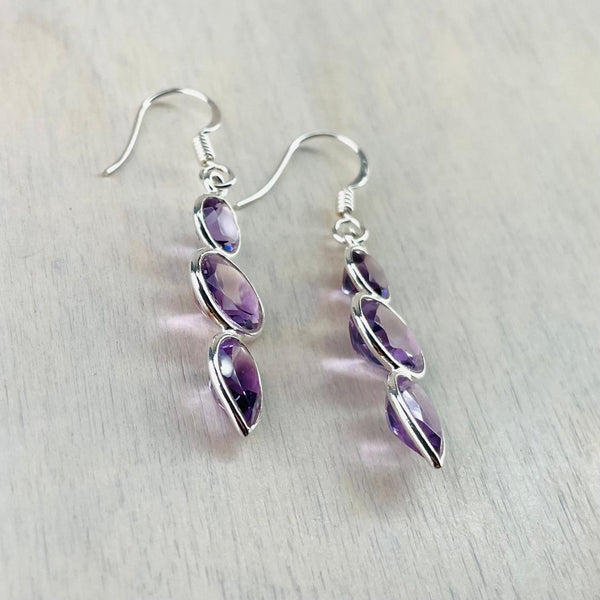Sterling Silver and Faceted Amethyst Triple Stone Drop Earrings.