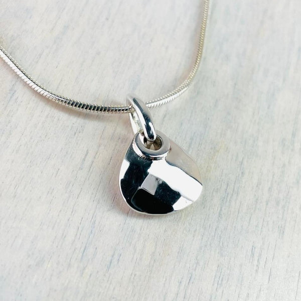 High Polish And Faceted Silver Pendant.