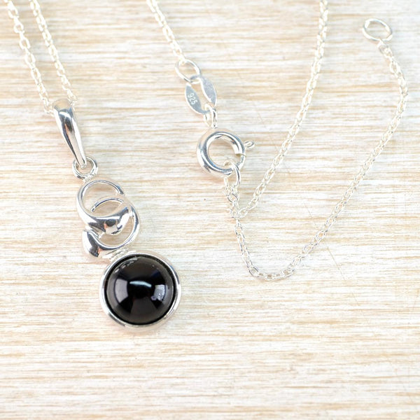 Sterling Silver and Black Onyx Pendant with a Double Circle Design.