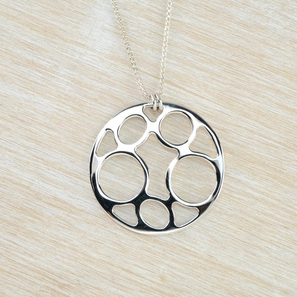 Contemporary Style Circular Sterling Silver Pendant.