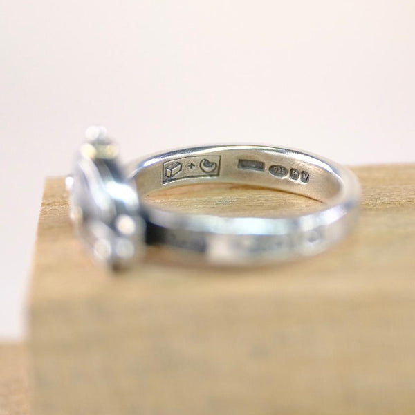 Silver ring with engraved text , maker's mark and hallmark