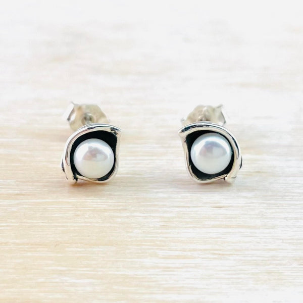 Sterling Silver and Round Freshwater Pearl Stud Earrings.