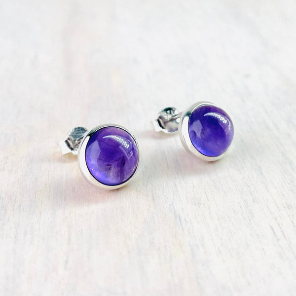 Round Sterling Silver and Cabochon Amethyst Stud Earrings.