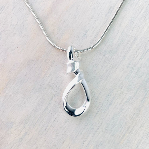 Twisted Brushed and Polished Silver Pendant by JB Designs. Twisted Brushed and Polished Silver Pendant by JB Designs.
