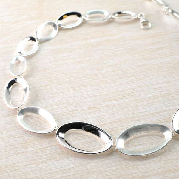 Oval Matt and Polished Sterling Silver Linked Necklace by JB Designs. Oval Matt and Polished Sterling Silver Linked Necklace by JB Designs.