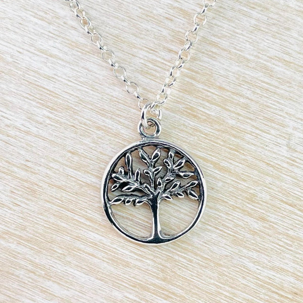 A sterling silver pendant featuring the 'Tree of Life' design, displayed on a silver chain.