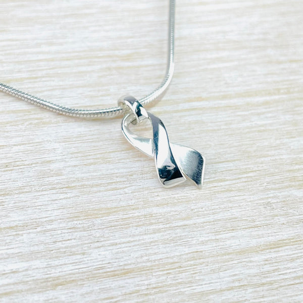 Satin and High Polished Sterling Silver Ribbon Pendant by JB Designs.