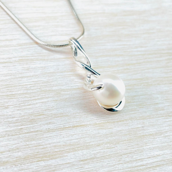 Double Twist Sterling Silver Pendant with a Single White Pearl.