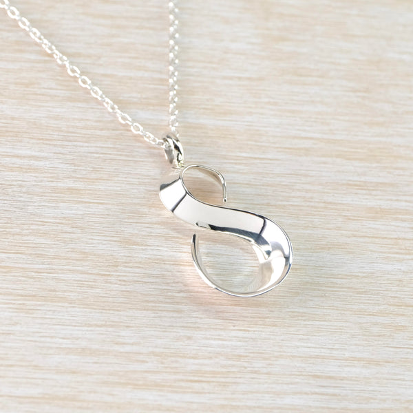 Polished Sterling Silver Figure of Eight Pendant.