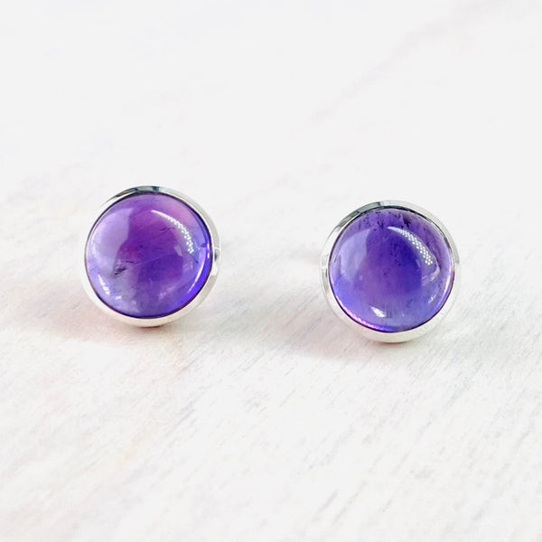 Round Sterling Silver and Cabochon Amethyst Stud Earrings.