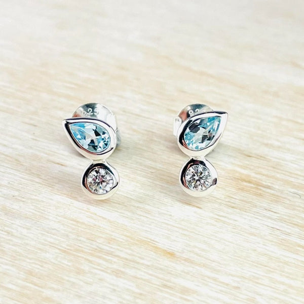 Sterling Silver, Blue Topaz and CZ Stud Earrings by JB Designs. Sterling Silver, Blue Topaz and CZ Stud Earrings by JB Designs.