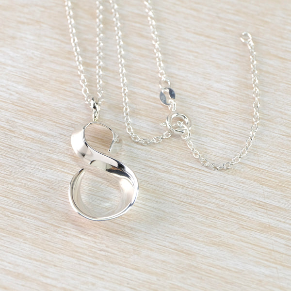 Polished Sterling Silver Figure of Eight Pendant.