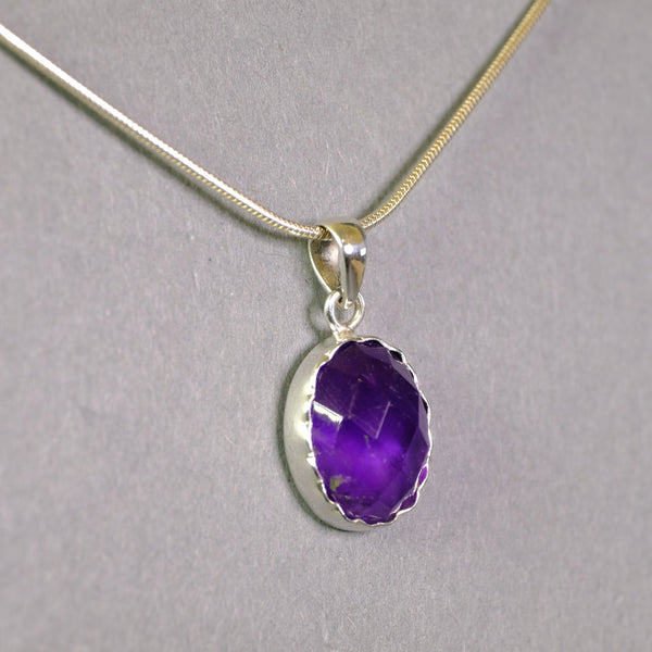 Oval Faceted Amethyst and Sterling Silver Pendant.