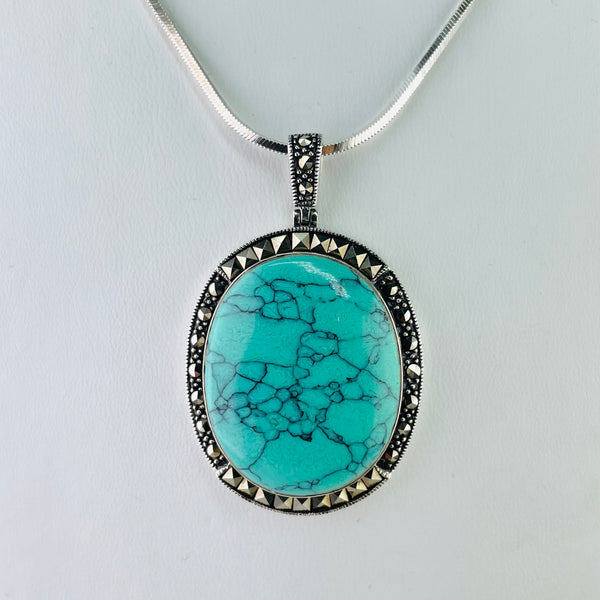 Oval Silver, Turquoise and Marcasite Pendant.