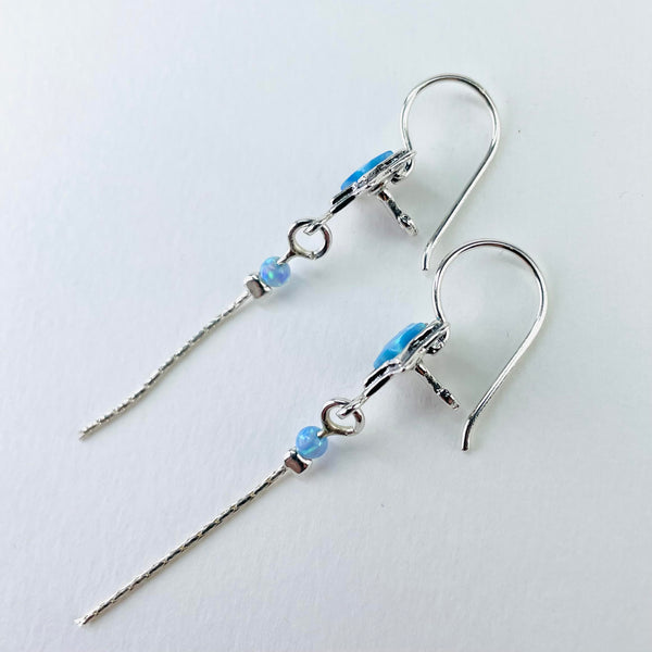 Long Opal and Silver Star Earrings.