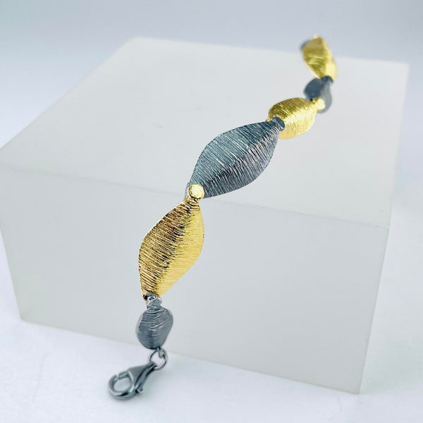 Silver and Gold Plated Leaf Linked Bracelet by JB Designs. Silver and Gold Plated Leaf Linked Bracelet by JB Designs.