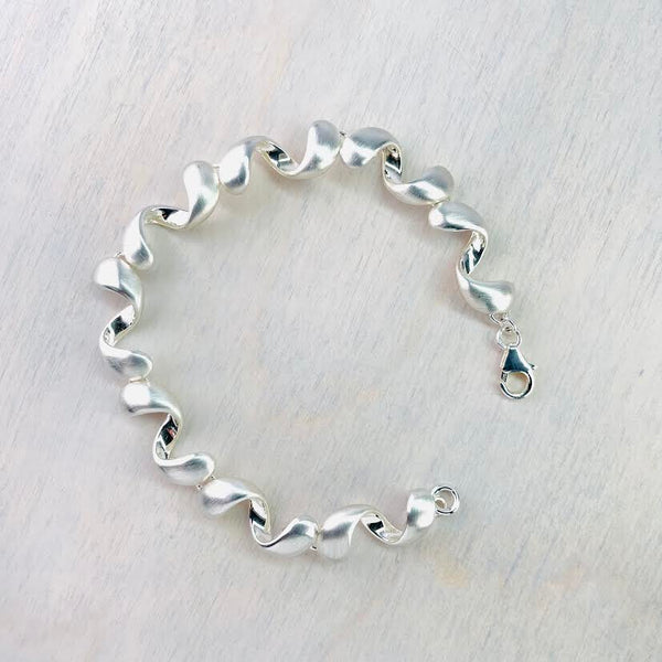 Matt and Polished Silver Curved 'Wiggly' Bracelet by JB Designs.