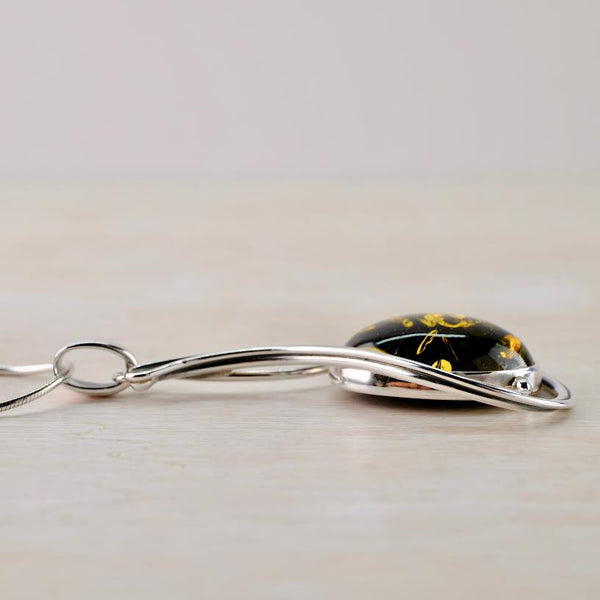 Art Nouveau Style Green Amber and Sterling Silver Pendant.