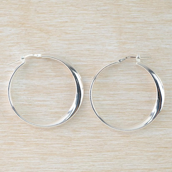 Larger Sterling Silver Mobius Design Hoop Earrings by JB Designs.