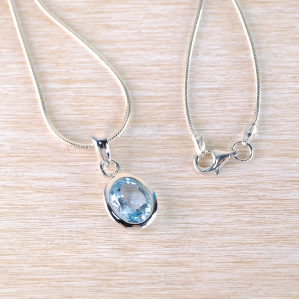 Simple Oval Blue Topaz and Silver Pendant.