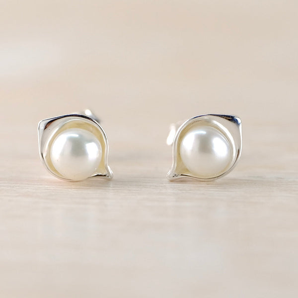 Sterling Silver and Round Freshwater Pearl Stud Earrings.