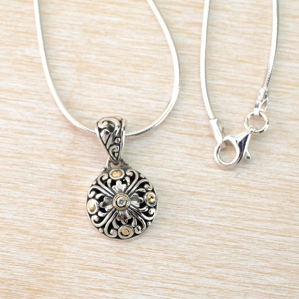 Silver, Cubic Zirconia and Gold Pendant.