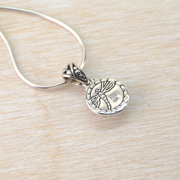 Silver, Cubic Zirconia and Gold Pendant.