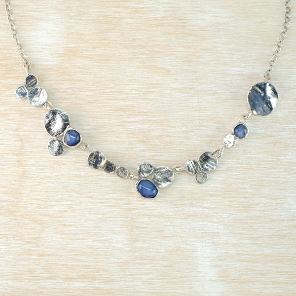 Organic Silver Disc and Kyanite Necklace by JB Designs.