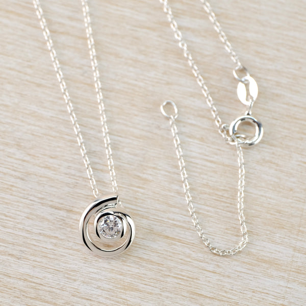 Sterling Silver and CZ Swirl Pendant by JB Designs.