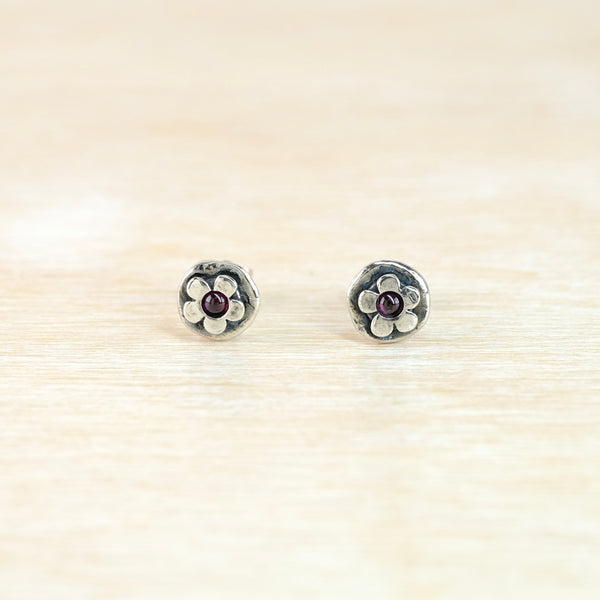Garnet and Silver Flower Stud Earrings.