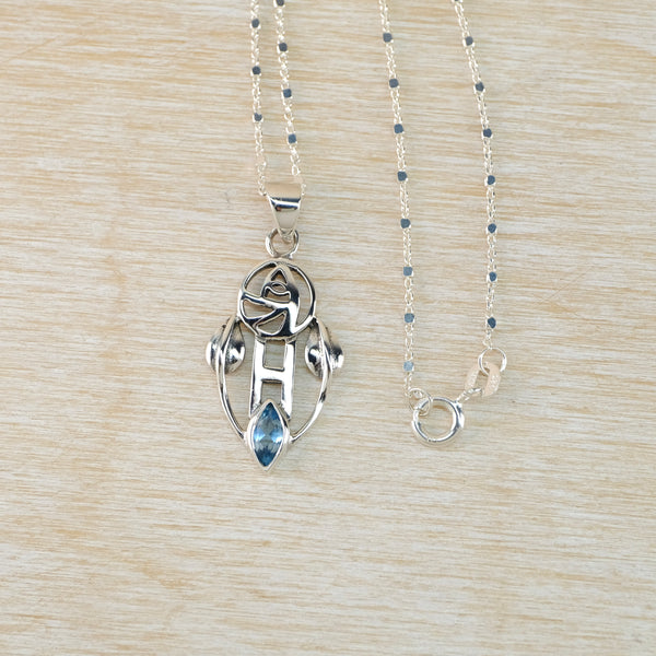 Vintage Sterling Silver Mackintosh Style Pendant with Blue Topaz.