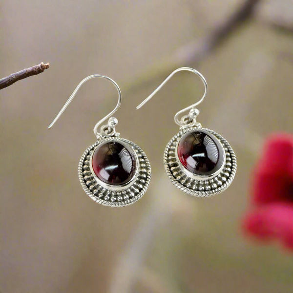 Decorated Oval Sterling Silver and Cabochon Garnet Drop Earrings.