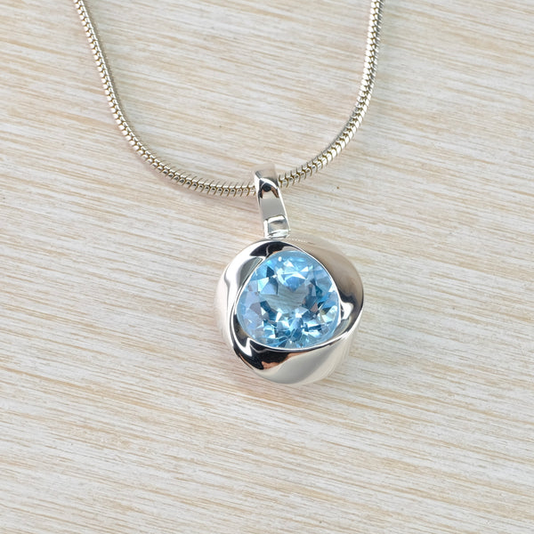 Knot Design Blue Topaz and Sterling Silver Pendant.